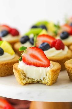 small patriotic desserts with blueberries and strawberries on top