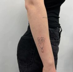 a woman with a small tattoo on her arm