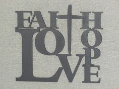 the words faith love are cut out of paper