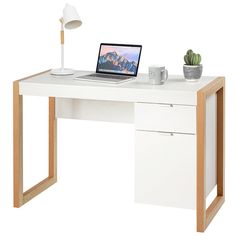 a white desk with a laptop on it