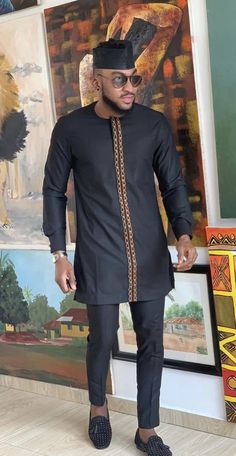 This black and gold Men’s African shirt and pants is finely and neatly made. It has a beautiful gold embroidery design and it’s made with high quality fabric. It has a perfect finish and it is perfect for any special occasion be it wedding, church, party, outdooring, etc. Mens Traditional Wear, Dashiki For Men, Costume Africain, African Suit, Nigerian Men Fashion, African Attire For Men, African Dresses Men, African Shirts For Men, African Dashiki