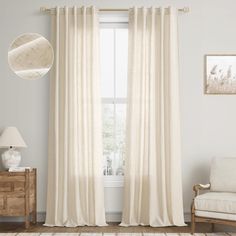 a living room with white walls and curtains