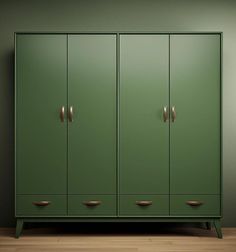 a green cabinet sitting on top of a wooden floor