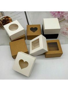 several boxes with hearts cut out of them