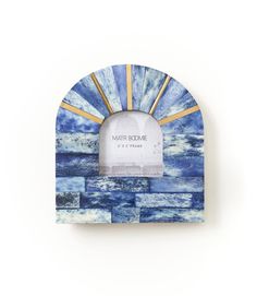 a blue and white photo frame with the words, art decome in gold on it