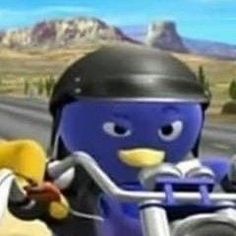 a lego character riding on the back of a motorcycle next to another person wearing a helmet