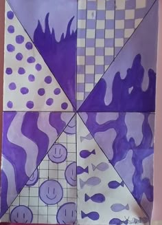 a piece of art that looks like it is made out of purple and white paper