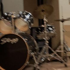 a drum kit sitting on top of a hard wood floor