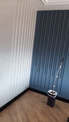 an empty room with a mop and bucket on the floor