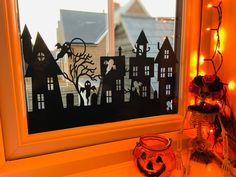 a window sill with a halloween scene on it