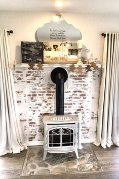 a white stove sitting in front of a brick wall