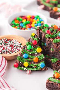 christmas tree brownies are decorated with candy and sprinkles on a table