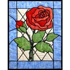 a stained glass window with a rose on it