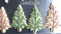 christmas cookies decorated with icing and frosting trees