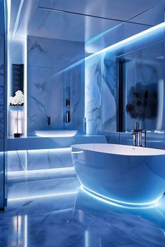 a modern bathroom with blue lighting and marble counter tops, along with an oval bathtub