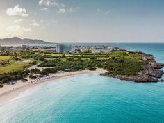 an aerial view of the resort and beach