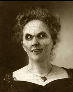 an old black and white photo of a creepy woman