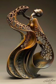 an artistic sculpture is shown in gold and black