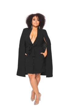 Elevated attire unearthing the boss in this double-breasted black blazer dress with a notch style collar, padded shoulders with mid-length sleeves, and button-loop closures. Crafted with a removable tie waist belt for a seamless transition from day to night. 100% Polyester Black Blazer Dress, Belted Cape, Mid Length Sleeves, Seamless Transition, Cape Dress, The Boss, Black Blazer, Blazer Dress, Xl Dress