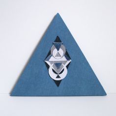 a blue triangle with an abstract design on it