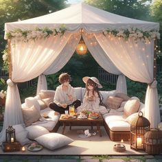 two people sitting on a couch in front of a gazebo covered with white curtains