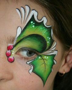 Holly Christmas face paint idea for rhr eye area. Face Paint Ideas, Butterfly Face Paint, Butterfly Face, Face Painting Designs, Eye Painting