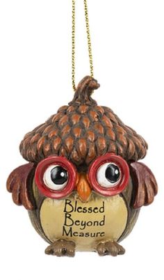 an owl ornament with glasses on it's head