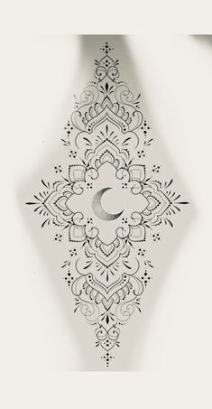 an intricate design with the moon in the middle