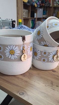 two baskets sitting on top of a wooden table