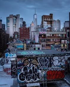 the city skyline is covered in graffiti