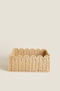 an empty wicker basket on a white background