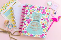 an open notebook sitting on top of a pink table