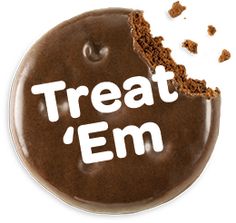 a chocolate donut with the word treat em on it