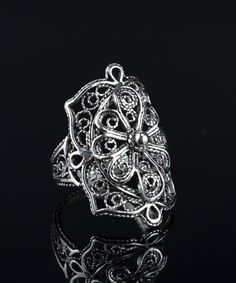 "This 925 Sterling silver filigree art lace detailed women cocktail ring will exact fit your style. Beautifully detailed intricated ornaments filigree art lace flower design statement ring will be favorite gift option for birthday, anniversary, thanksgiving or Christmas for her or yourself.  Gorgeous design, exquisite workmanship. The ring face length is 1.05\" and width is 0.65\" Comes with a gift box.  Filigree is made of delicate metal strands that have been skillfully fashioned to create an outstanding combination of old and modern art. Originating in Mesopotamia, Anatolia. It is made of delicate metal strands that have been skillfully fashioned to create an outstanding combination of old and modern art." Elegant Metal Rings With Intricate Design, Ornate Sterling Silver Filigree Ring, Silver Filigree Open Ring, Bohemian Filigree Open Ring With Intricate Design, Bohemian Open Filigree Ring With Intricate Design, Bohemian Flower Ring With Intricate Design, Bohemian Flower Ring With Intricate Design For Gift, Silver Filigree Flower Ring For Wedding, Elegant Silver Filigree Open Ring