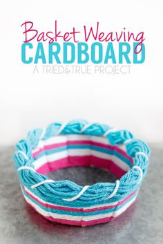 a blue and pink bracelet sitting on top of a table