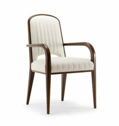 the arm chair is made from wood and white fabric