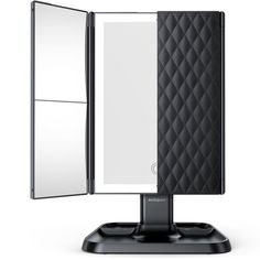 a mirror that is sitting on top of a black stand with it's reflection in the mirror