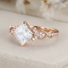 a rose gold engagement ring with a princess cut diamond