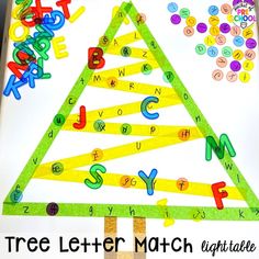 a christmas tree made out of letters and numbers on a sheet of paper with the words abc