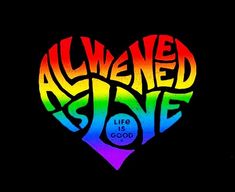 a heart shaped with the words alive is love in rainbow colors on a black background