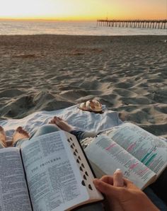 Christian couple reading their bibles together on vacation on the beach during the sunset The Ocean, See More, The Beach, Bible, Reading