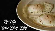 two fried eggs on a white plate with the words, no flip over easy egg