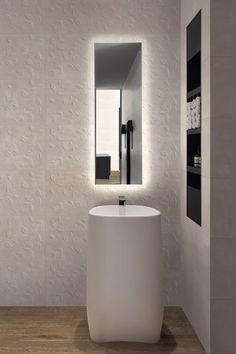 a modern bathroom with white walls and wood flooring