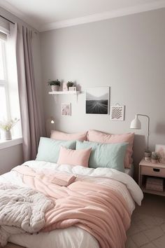 a bed with pink and white sheets in a bedroom next to a window, some pictures on the wall