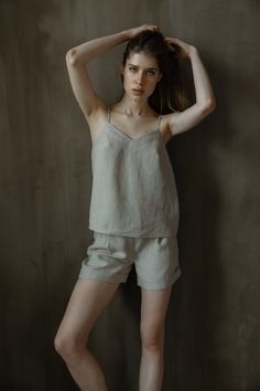 Skin friendly 100% linen top is for timeless wearing. This model features adjustable straps. Lightweight linen tank top can be paired with denim, shorts or even skirts so it's easy to wear in your daily life during tropical summer weather or as a layer with blazer during chilly evenings.  Camisole design delivers minimalist design for your daily outfit.  Adjustable spaghetti strap top is so easy to wear.  Basic top LINDA is handmade of 100% pure linen.  Model is 5.9ft (180cm) tall, wearing size Summer Loungewear Tank Top With Adjustable Straps, Summer Tank Top With Adjustable Straps For Loungewear, Summer Loungewear Camisole, Chic Linen Tank Top With Adjustable Straps, Minimalist Relaxed Fit Summer Tops, Spring Sleeveless Linen Camisole, Relaxed Summer Tank Top For Vacation, Relaxed Summer Vacation Tank Top, Simple Beige Tops For Summer