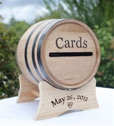 a wooden wine barrel with the name cards on it