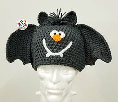 a crocheted hat with an angry bird on it's head and eyes