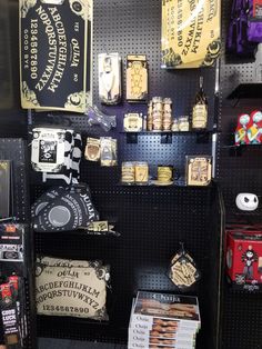 there are many items on the shelves in this store that is decorated with black and gold