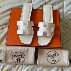 White Oran Calfskin Leather Size 38.5 Used, Comes With A Box, Ribbon And Dustbags White Hermes Oran, Hermes White Sandals, Hermes Sandals Fur, Box Ribbon, Hermes Oran, Hermes Shoes, A Box, Women's Shoes Sandals, Calf Skin