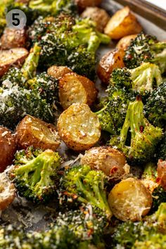 broccoli and potatoes with parmesan sprinkles on a baking sheet